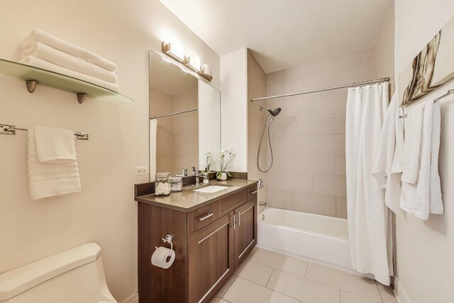 770 W Gladys Ave Unit 204, Chicago, IL 60661 - bathroom featuring tile patterned floors, toilet, shower / bath combo, and vanity