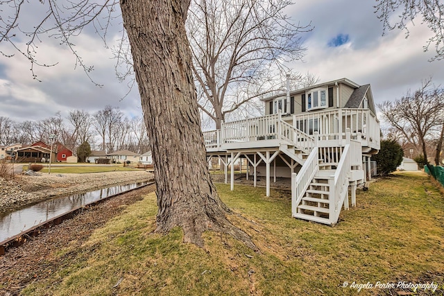 41551 N Lotus Ave, Antioch, IL 60002 - back of property with stairs, a wooden deck, and a yard
