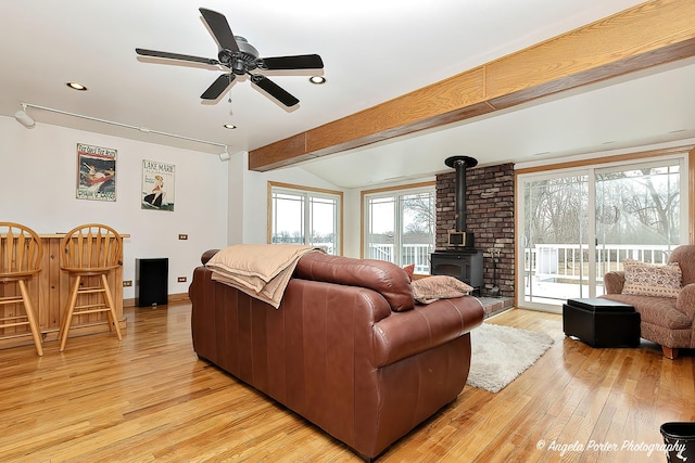 41551 N Lotus Ave, Antioch, IL 60002 - living room with a wood stove, light wood-type flooring, ceiling fan, recessed lighting, and baseboards