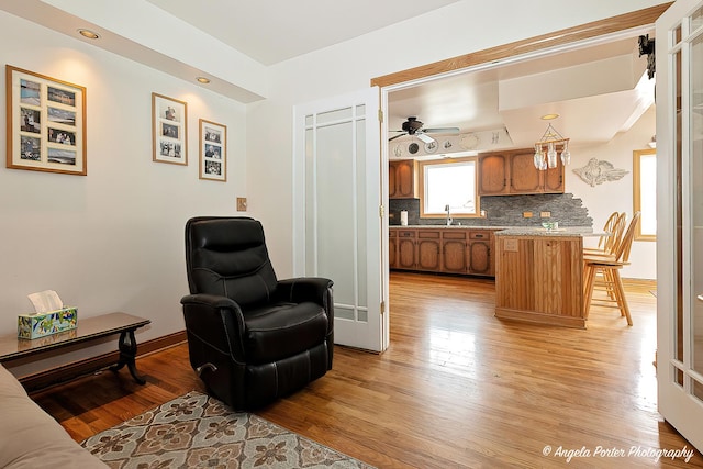 41551 N Lotus Ave, Antioch, IL 60002 - sitting room with light wood finished floors, ceiling fan, and baseboards