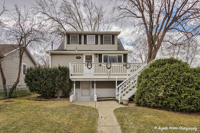 41551 N Lotus Ave, Antioch, IL 60002 - view of front of house with stairs, a front lawn, and a wooden deck