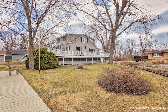 41551 N Lotus Ave, Antioch, IL 60002 - rear view of house with a deck and a lawn