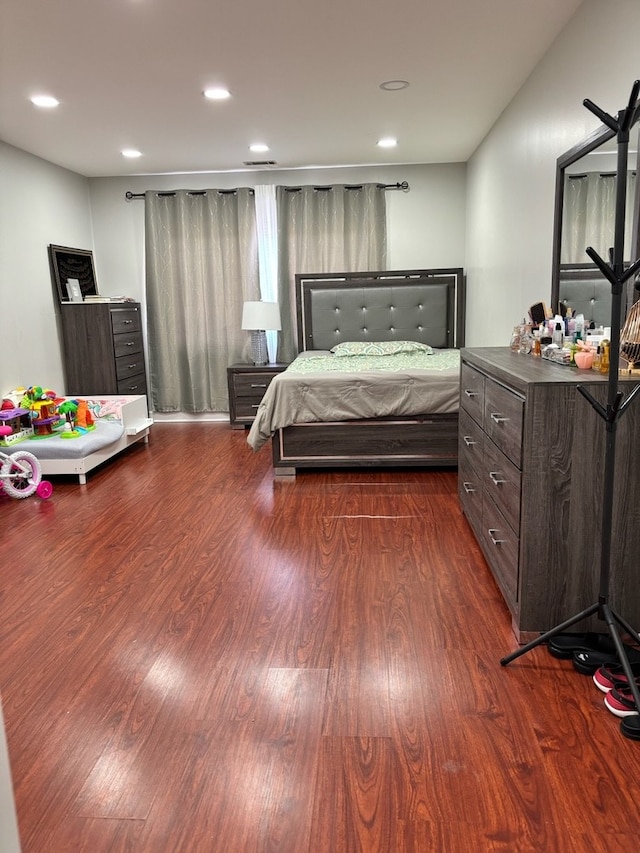 bedroom featuring dark wood-style flooring and recessed lighting