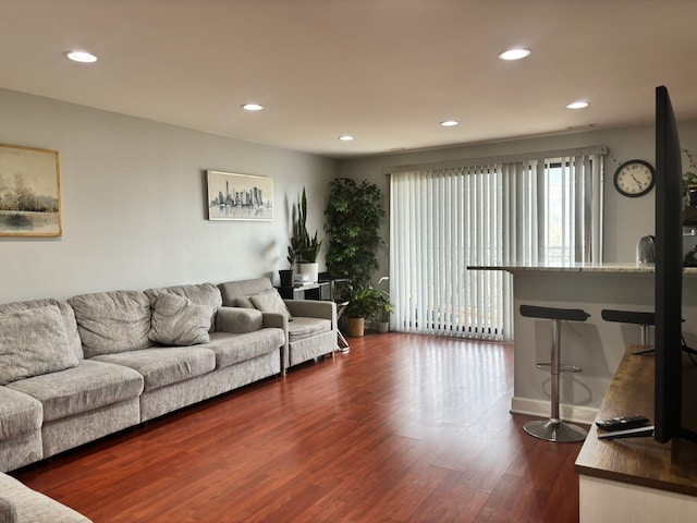 living room featuring recessed lighting and dark wood-type flooring