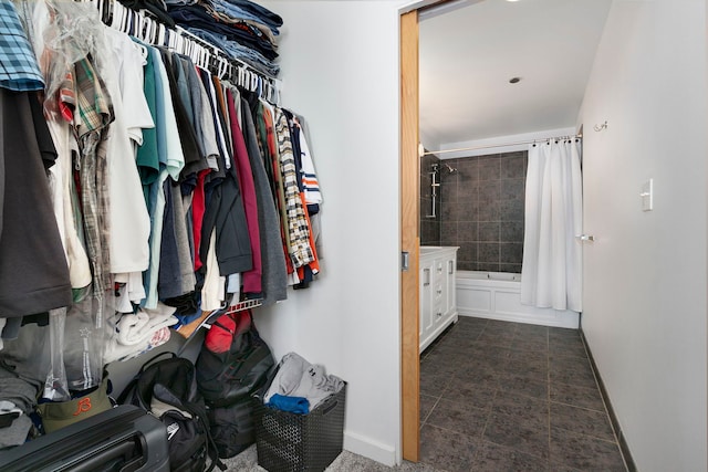 spacious closet featuring tile patterned flooring