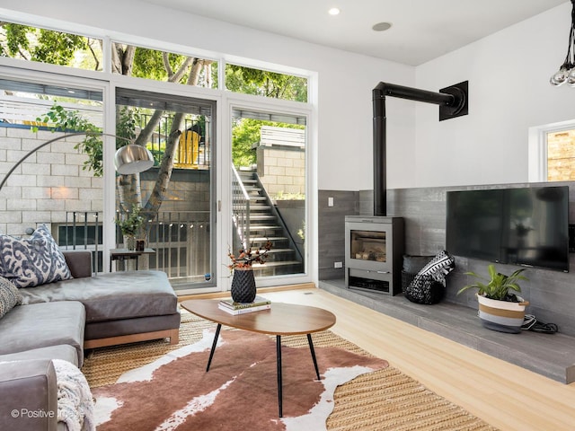 1729 W Potomac Ave, Chicago, IL 60622 - living room featuring wood finished floors, a wood stove, and recessed lighting