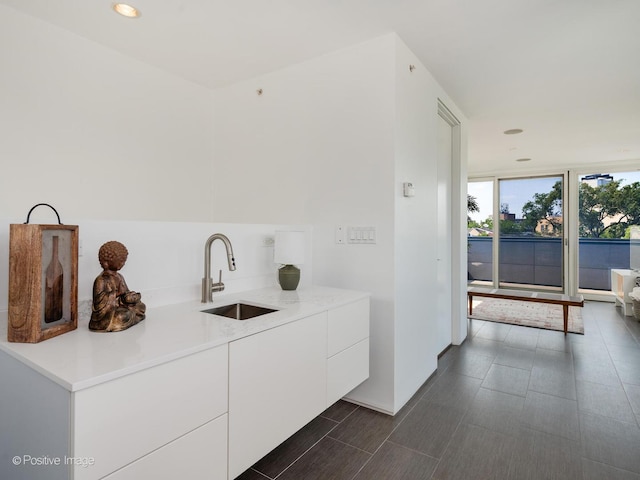 1729 W Potomac Ave, Chicago, IL 60622 - kitchen with white cabinetry, modern cabinets, light countertops, and recessed lighting