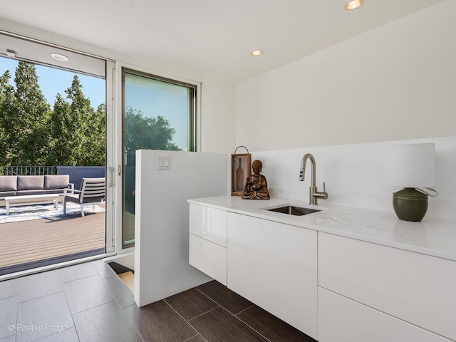 1729 W Potomac Ave, Chicago, IL 60622 - kitchen featuring light countertops, modern cabinets, white cabinets, and recessed lighting