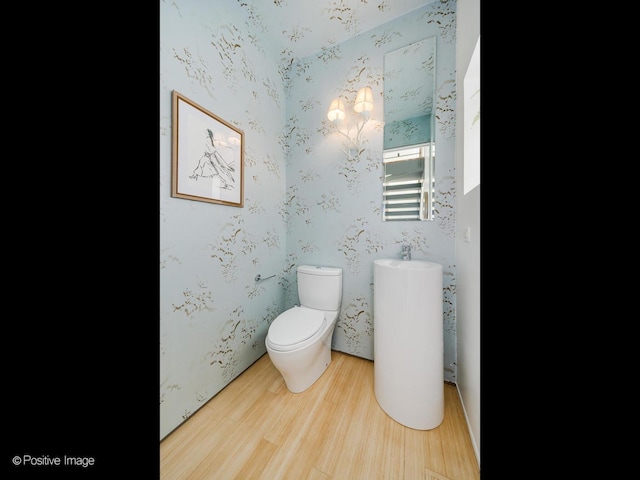1729 W Potomac Ave, Chicago, IL 60622 - half bath featuring wood finished floors and toilet