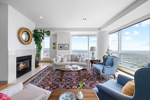 445 E N Water St Unit 2105, Chicago, IL 60610 - living area featuring plenty of natural light, a water view, a tile fireplace, and recessed lighting