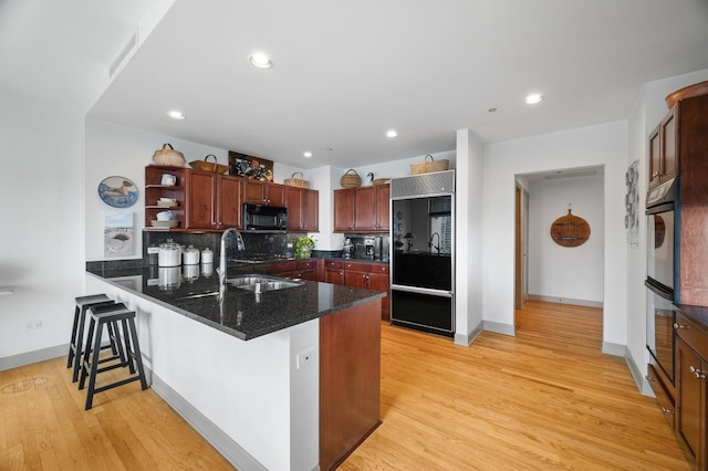 445 E N Water St Unit 2105, Chicago, IL 60610 - kitchen with black microwave, refrigerator, open shelves, a peninsula, and a kitchen breakfast bar