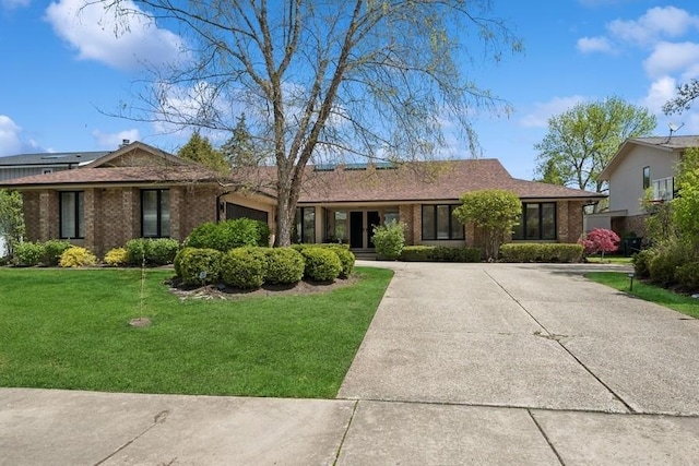 3726 Pebble Beach Rd, Northbrook, IL 60062 - ranch-style home with brick siding, an attached garage, a front yard, and driveway
