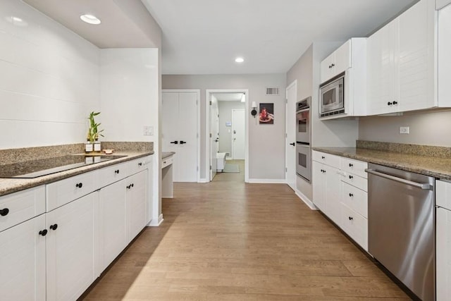 3726 Pebble Beach Rd, Northbrook, IL 60062 - kitchen with appliances with stainless steel finishes, light wood-style flooring, white cabinetry, recessed lighting, and baseboards