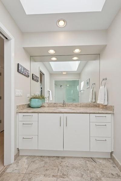 3726 Pebble Beach Rd, Northbrook, IL 60062 - bathroom with a skylight, a shower stall, vanity, baseboards, and recessed lighting