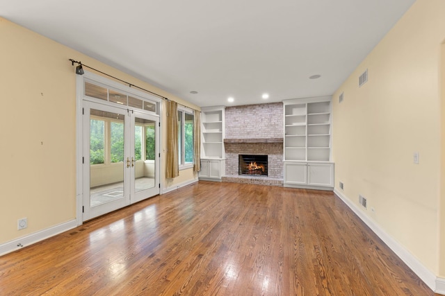 1161 Gavin Ct, Lake Forest, IL 60045 - unfurnished living room with wood finished floors, french doors, baseboards, a brick fireplace, and built in features