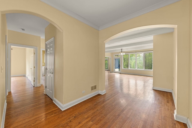 1161 Gavin Ct, Lake Forest, IL 60045 - hallway featuring wood finished floors, baseboards, arched walkways, a chandelier, and ornamental molding
