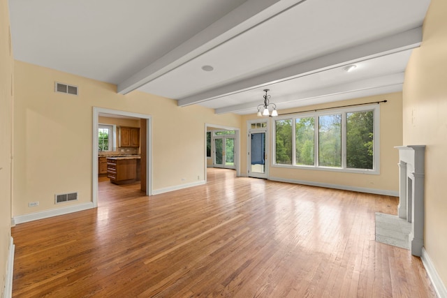 1161 Gavin Ct, Lake Forest, IL 60045 - unfurnished living room featuring baseboards, beam ceiling, light wood-style floors, a chandelier, and a fireplace