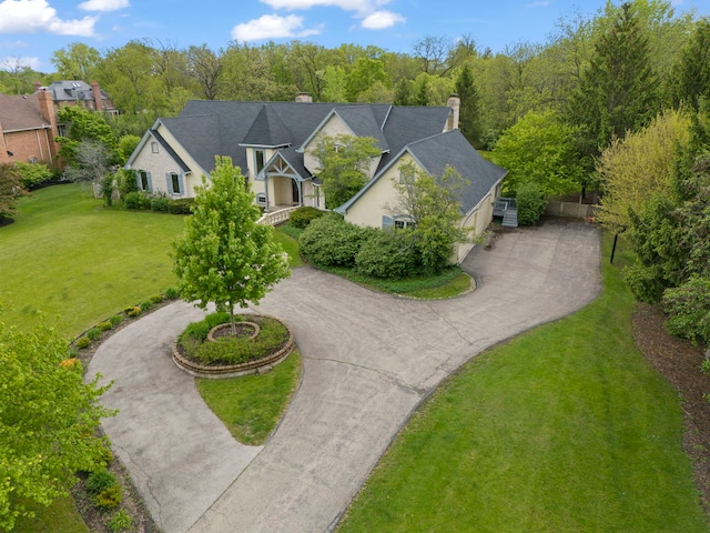 1161 Gavin Ct, Lake Forest, IL 60045 - view of front of house with curved driveway, a chimney, and a front yard