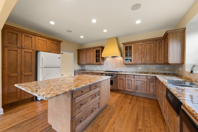 1161 Gavin Ct, Lake Forest, IL 60045 - kitchen featuring premium range hood, a sink, stainless steel appliances, brown cabinets, and recessed lighting