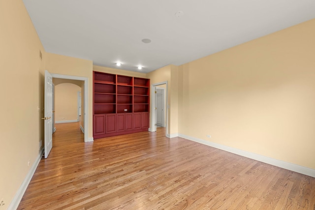 1161 Gavin Ct, Lake Forest, IL 60045 - unfurnished bedroom with light wood finished floors, baseboards, and arched walkways