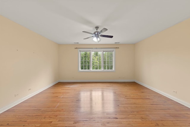 1161 Gavin Ct, Lake Forest, IL 60045 - spare room featuring light wood-style floors, a ceiling fan, and baseboards
