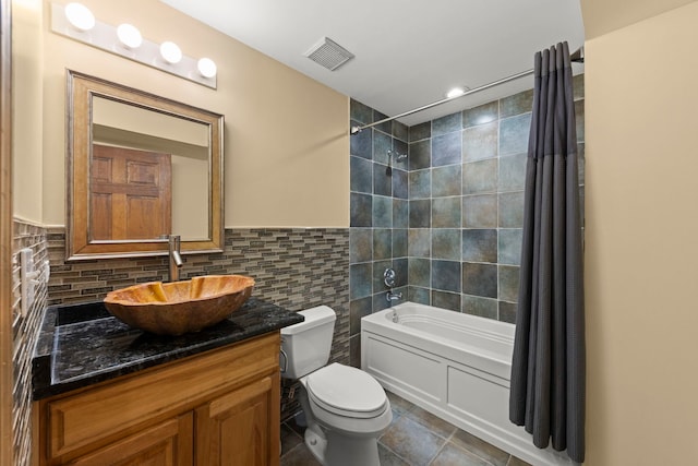 1161 Gavin Ct, Lake Forest, IL 60045 - bathroom with toilet, shower / bathtub combination with curtain, vanity, tile patterned floors, and tile walls