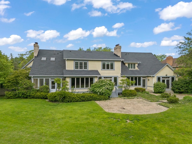 1161 Gavin Ct, Lake Forest, IL 60045 - rear view of property featuring a chimney, a lawn, and a patio