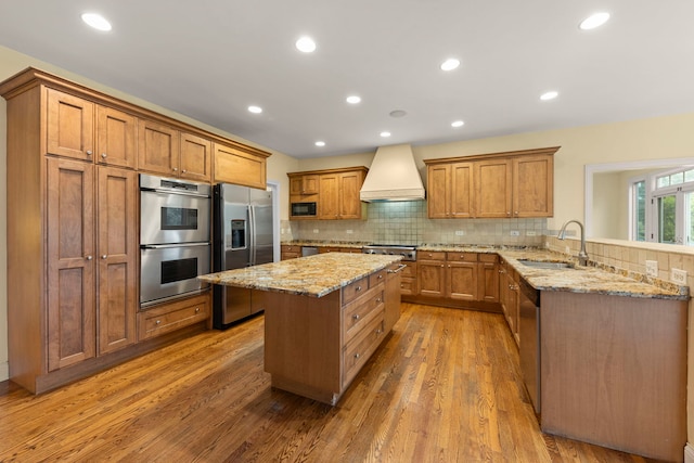 1161 Gavin Ct, Lake Forest, IL 60045 - kitchen featuring appliances with stainless steel finishes, custom range hood, a sink, brown cabinets, and wood finished floors