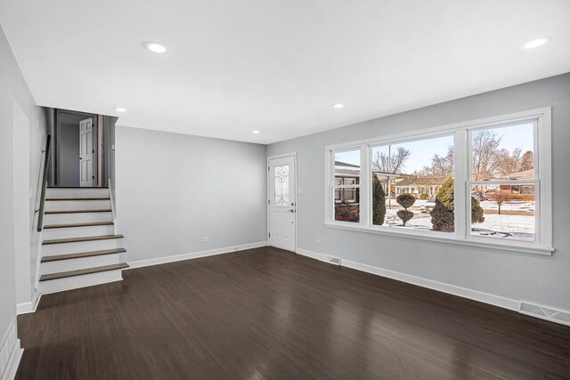 16779 92nd Ave, Orland Hills, IL 60487 - unfurnished living room with dark wood-type flooring, baseboards, stairway, and recessed lighting