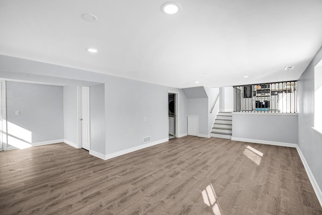 16779 92nd Ave, Orland Hills, IL 60487 - unfurnished living room with stairway, wood finished floors, baseboards, and recessed lighting