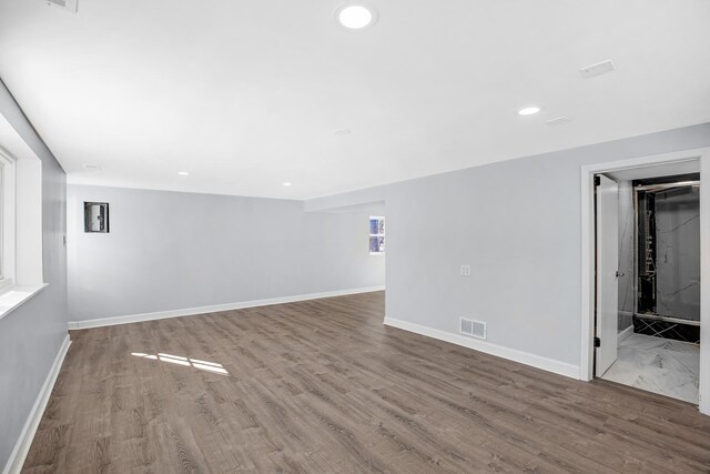 16779 92nd Ave, Orland Hills, IL 60487 - unfurnished living room with baseboards, wood finished floors, and recessed lighting