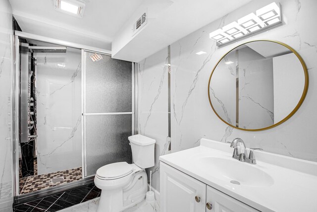 16779 92nd Ave, Orland Hills, IL 60487 - bathroom with marble finish flooring, toilet, a marble finish shower, and vanity