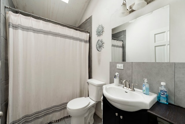 16040 Lockwood Ave, Oak Forest, IL 60452 - bathroom featuring toilet, vanity, vaulted ceiling, and curtained shower