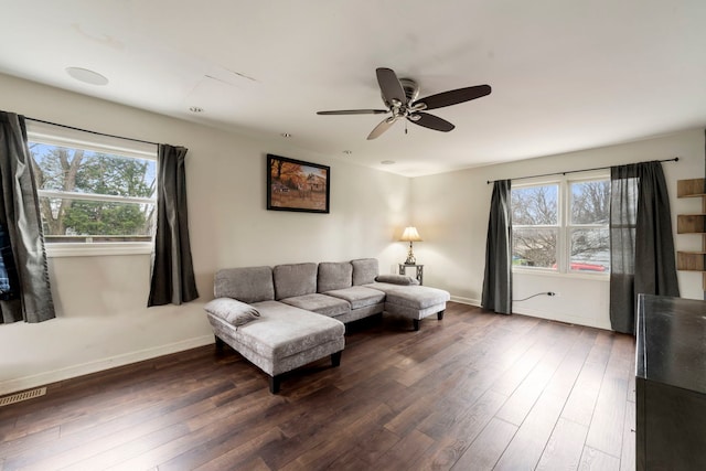 16040 Lockwood Ave, Oak Forest, IL 60452 - living area with dark wood-style floors, healthy amount of natural light, ceiling fan, and baseboards