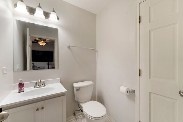 16040 Lockwood Ave, Oak Forest, IL 60452 - bathroom with toilet, vanity, ceiling fan, and baseboards