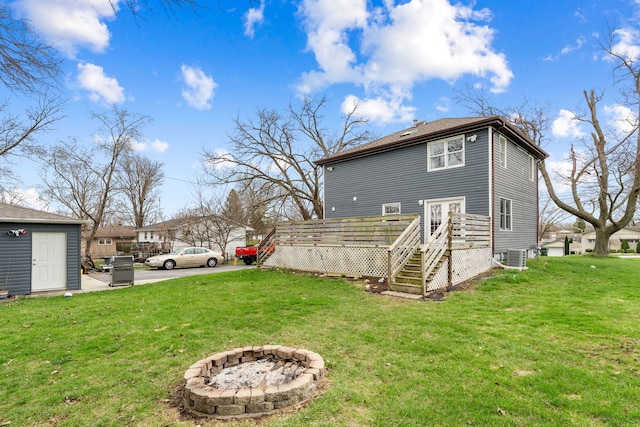 16040 Lockwood Ave, Oak Forest, IL 60452 - back of property featuring a deck, a yard, central AC unit, a fire pit, and stairway