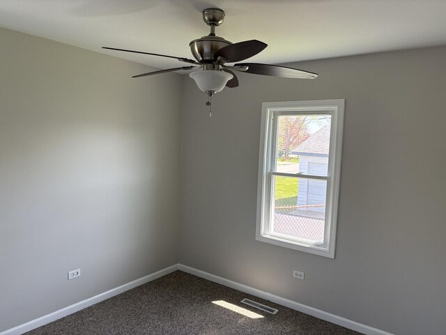 37863 N Harper Rd, Beach Park, IL 60087 - unfurnished room featuring baseboards, dark colored carpet, and ceiling fan