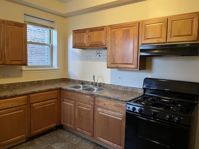 3118 W Douglas Blvd, Chicago, IL 60623 - kitchen with black gas stove, under cabinet range hood, a sink, dark countertops, and brown cabinets