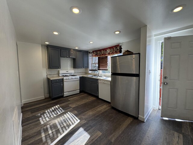 75 E 37th Pl, Chicago, IL 60653 - kitchen with white appliances, gray cabinets, a sink, light countertops, and dark wood finished floors