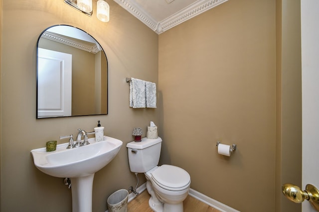 24706 Apollo Dr, Plainfield, IL 60585 - bathroom featuring ornamental molding, toilet, wood finished floors, and baseboards