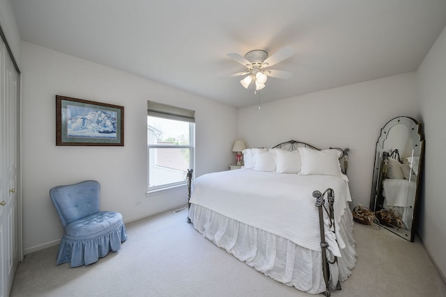 24706 Apollo Dr, Plainfield, IL 60585 - bedroom with light colored carpet, baseboards, a ceiling fan, and a closet