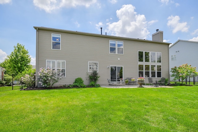 24706 Apollo Dr, Plainfield, IL 60585 - back of house with a chimney and a patio area