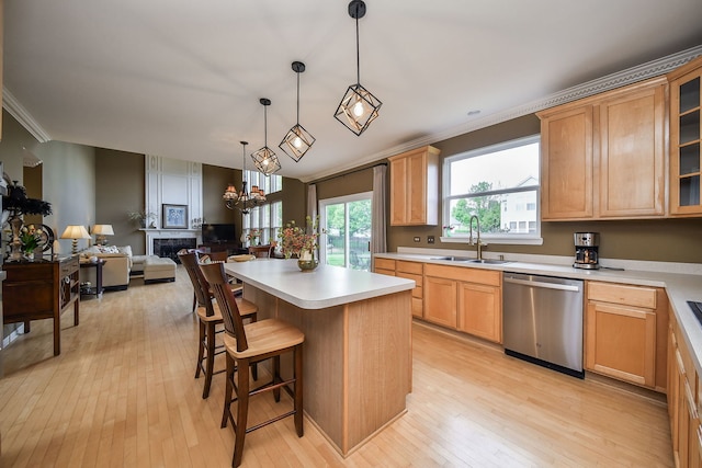 24706 Apollo Dr, Plainfield, IL 60585 - kitchen with dishwasher, a sink, crown molding, a kitchen island, and light wood-type flooring