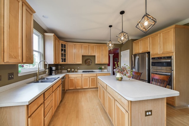 24706 Apollo Dr, Plainfield, IL 60585 - kitchen with a sink, appliances with stainless steel finishes, light brown cabinetry, a kitchen island, and light countertops