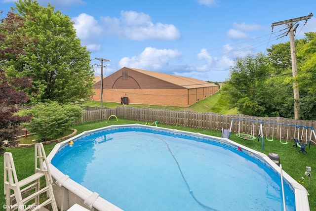 202 W Tanglewood Dr, Arlington Heights, IL 60004 - view of swimming pool featuring a fenced backyard and a playground