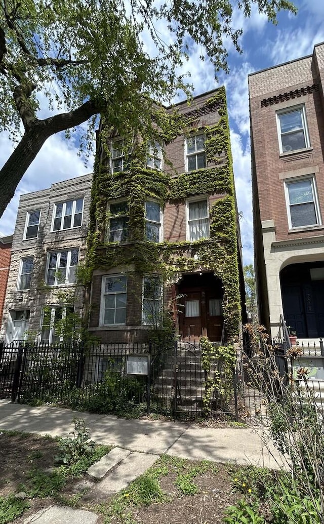 view of property with a fenced front yard