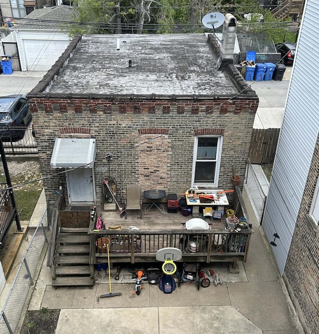 back of house featuring brick siding
