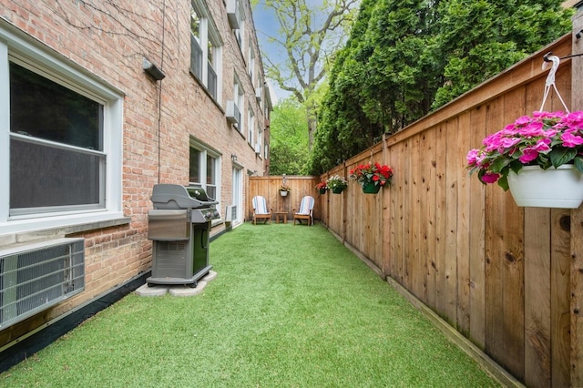 view of yard featuring central AC unit