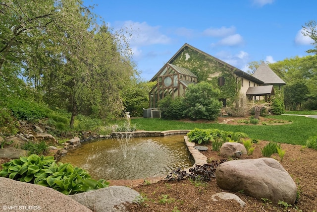236 Steeplechase Rd, Barrington Hills, IL 60010 - view of green lawn with a garden pond and central air condition unit