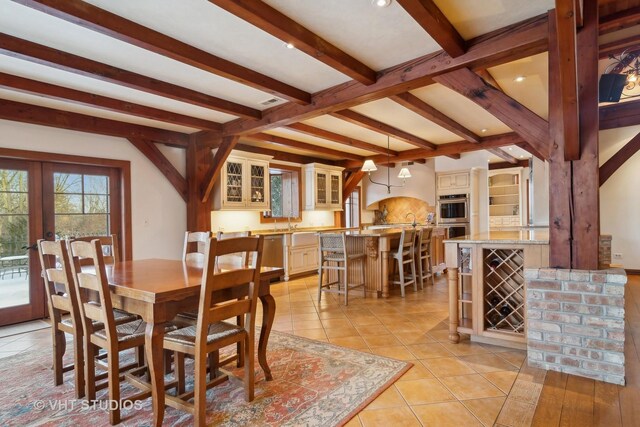 236 Steeplechase Rd, Barrington Hills, IL 60010 - dining space with beam ceiling, french doors, light tile patterned flooring, and recessed lighting